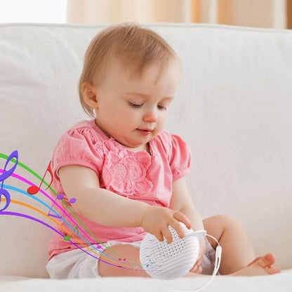 Veilleuse bruit blanc dans les main de bébé